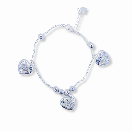 PULSERA CON DIJES DE CORAZÓN CALADO Y CIRCONES