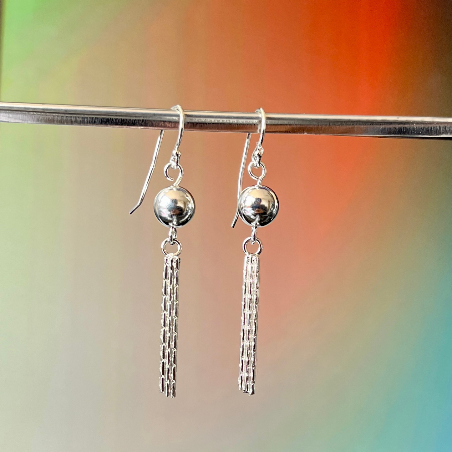 Aros – Esfera con Flecos en Cadena